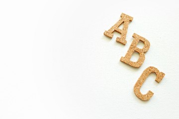 Wooden English alphabet on white background 