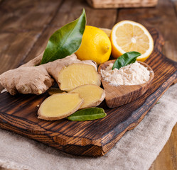 Ginger and lemon on a wooden background, Photo in a rustic style. Ingredients for warming and health drink. Alternative medicine. Free space for text.