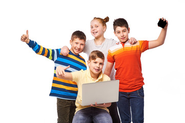 Education, children, technology, science - group of happy kids with laptop computer