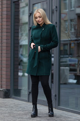 young stylish beautiful woman walking in street, wearing coat , fashion outfit, autumn trend.