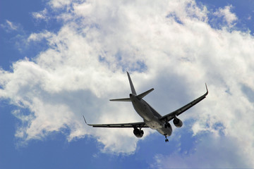 Fototapeta na wymiar Jet airplane flying in the sky