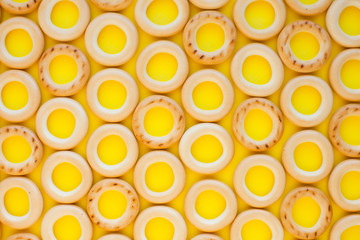 Food pattern with bagels on the yellow background. For design and decoration. Creative background.