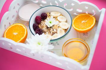 Delicious and healthy breakfast on a white tray. Space for a text. Top view.