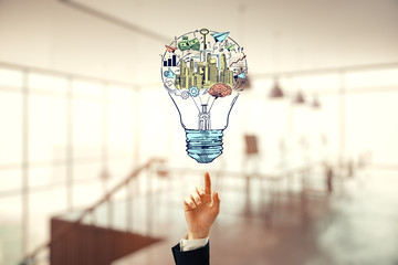 Hand drawing business idea concept on office background.
