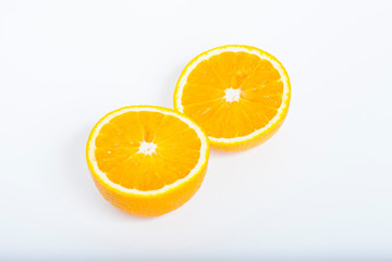 Sliced orange isolated on white. Healthy food, diet and cooking concept.