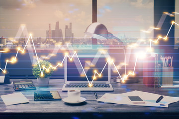 Double exposure of stock market chart and office desktop on background. financial strategy concept.