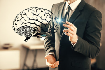 double exposure of human brain sketch and man hand. Brainstorming concept.