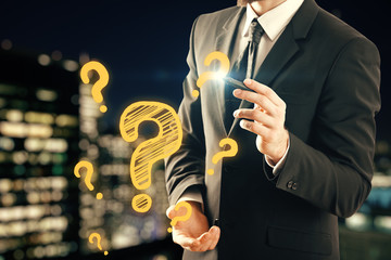 Double exposure of man hands with question marks. Consept of asking and searching information.