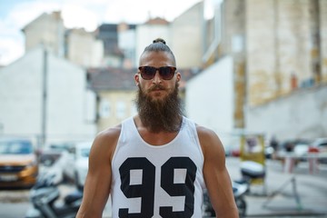 Street portrait of young bearded man