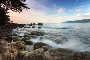 beach with boulders on the ocean shore