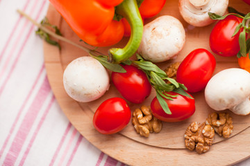 Healthy food concept. Fresh organic vegetables on the red polka-dot background. Ingredients for cooking. Close up. Top view.