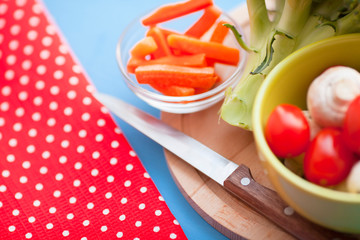 Healthy food concept. Fresh organic vegetables on the red polka-dot background. Ingredients for cooking. Close up. Top view.