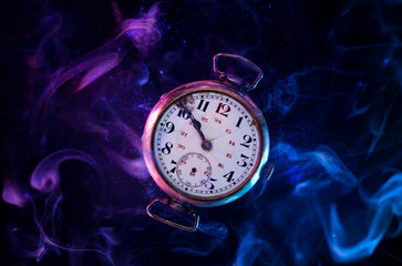 Conceptual photo of an old levitating pocket watch.
