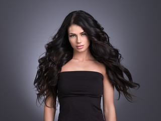 Fototapeta premium Beautiful hair woman long hairstyle brunette female young healthy hair beauty model