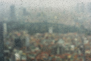 raindrops on window glass, yellow - 251778354