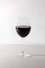 Glass of red wine isolated on white background. A glass of red wine. Copy space. Concept restaurant, alcohol, party.