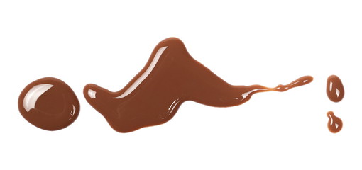 Chocolate milk puddle isolated on white background, top view