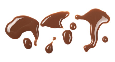 Chocolate milk puddle isolated on white background, top view