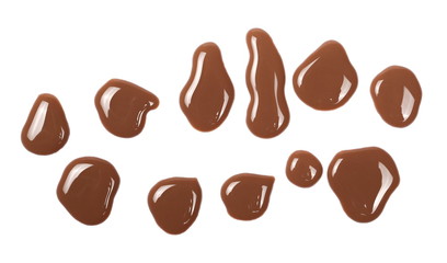 Chocolate milk puddle isolated on white background, top view