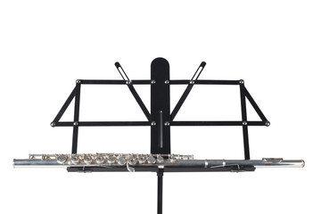transverse flute rest on a  black music stand isolated on white background  with clipping path and copy space for your text