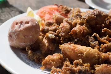 Fried chopitos, typical dish of Spanish food. Chopitos de lanzarote with crumpled potatoes
