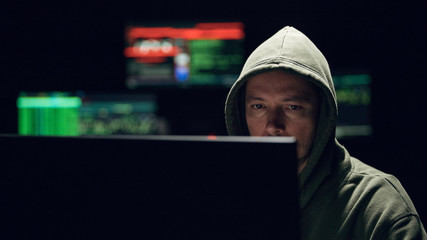 Hacker computer room with data on the screens