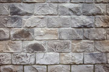 Closeup of old grey and rough sandstone wall. For pattern, texture and background