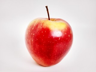 red with yellow apple on white background
