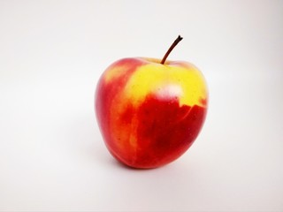 red with yellow apple on white background