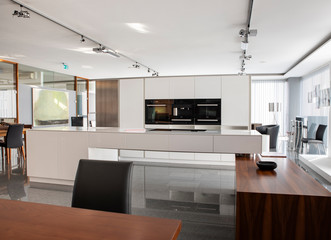 Spacious villa interior with cement wall effect