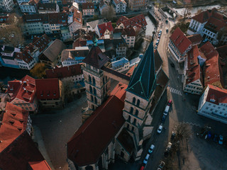 Fototapeta na wymiar Aerial drone shot of a beautiful old and medieval church in the traditional City of Esslingen am Neckar in South Germany