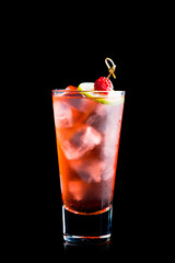 Sweet raspberry cocktail with lime slice isolated on black background. Selective focus. Shallow depth of field. 