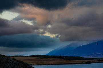 Storm clouds at sunset over Eyjafjordur fiord forming dramatic skyscape near Akureyri, Iceland, IS, Europe