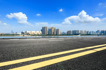 Empty asphalt road and modern city skyline with buildings in Hangzhou