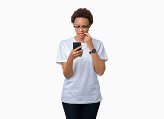 Young african american woman using smartphone over isolated background serious face thinking about...