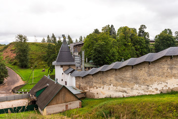 Fototapeta na wymiar The Walls and Tower of the Holy Dormition Pskovo-Pechersky (Pskov-Caves) Monastery. Pechory, Russia.