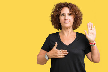 Beautiful middle ager senior woman over isolated background Swearing with hand on chest and open...