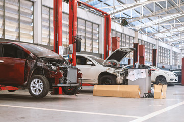 closeup car in repair station and body shop with soft-focus and over light in the background