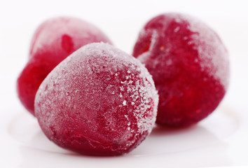 Group of frozen cherries.