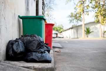 closeup trash bin with soft-focus and over light in the background