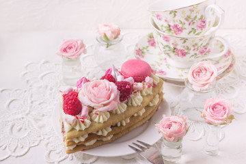 Fototapeta na wymiar A piece of cake with flowers. Romantic Valentine's Day breakfast.