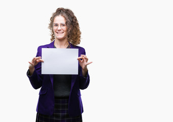 Young brunette student girl wearing school uniform holding blank paper over isolated background with a happy face standing and smiling with a confident smile showing teeth