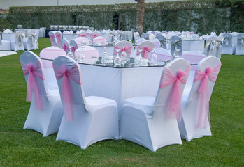 Round tables decorated for a party or wedding reception in garden