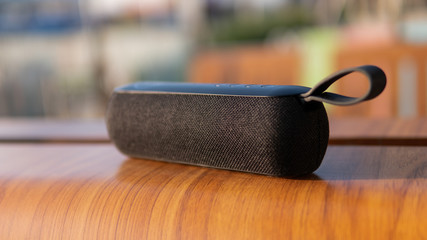 wireless speaker in use. Music lovers and modern audio technology