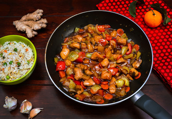 Stir fry chicken with vegetables and risee. Asian cuisine.