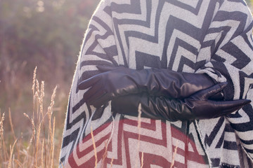 woman in poncho, close-up