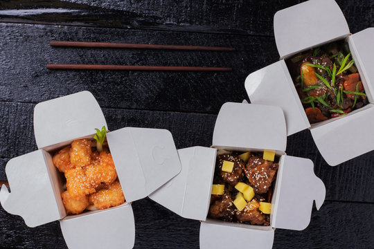food sushi, nagets, chicken in paper boxes
