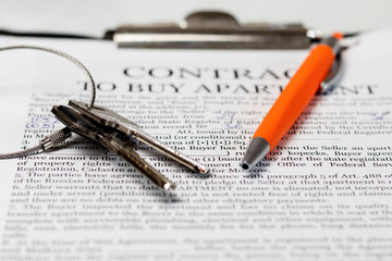 This is a contract for the purchase of an apartment. There are two keys to them. ballpoint pen for signing.