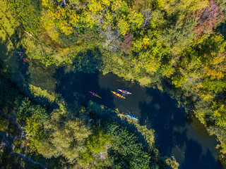 Aerial drone bird's eye view photo of Happy family with two kids enjoying kayak ride on beautiful...