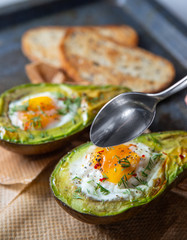 Baked avocado with egg and toast